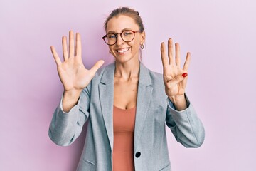 Beautiful caucasian woman wearing business jacket and glasses showing and pointing up with fingers...