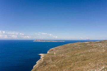 Aerial drone shot of Adriatic sea horizon with Bisevo Island in Croatia summer morning