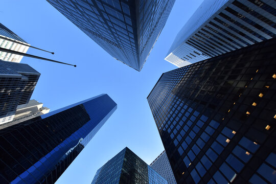 Worm's-eye view architecture and blue background , Lower Manhattan, New York City, USA