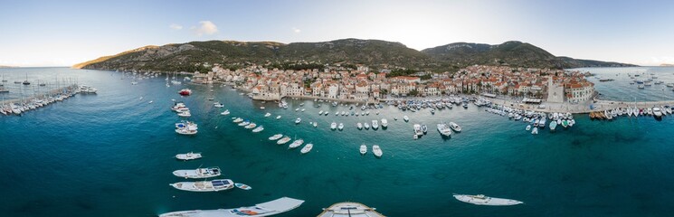 Aerial 360 panorama drone shot of Komiza town of Vis Island before sunrise hour in Croatia summer