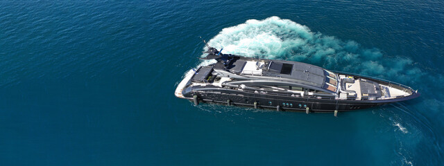 Aerial drone ultra wide photo of luxury yacht cruising in deep blue sea near Mediterranean Aegean...