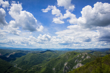 Phenomenal view from Mount Ovčar on the incredible sky, clouds and hills in the distance.