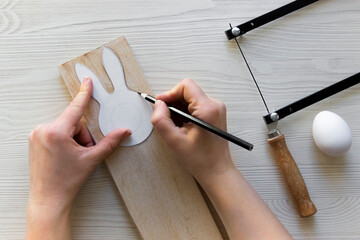 do it yourself: easter bunny - wooden egg stand. Step 2: outline the bunny stencil on the board