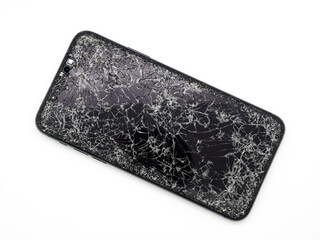 Modern midnight green smartphone with a broken glass display and damaged curved body close-up isolated on white background