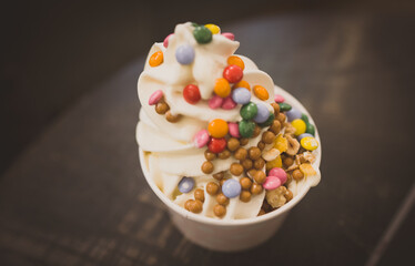 Ice cream with colored chocolate dragees.