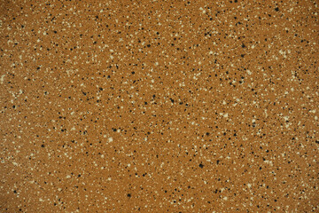 texture of polished brown granite with black and white splashes