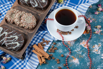 Chocolate sesame cookies served with a cup of drink