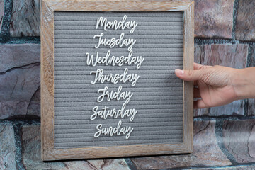 Happy weekdays posters embedded on grey background