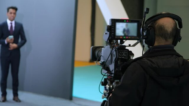 Camera operator working with a cinema broadcast TV camera