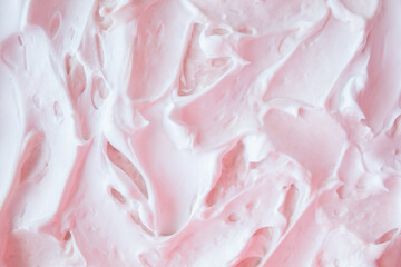 Mousse raw dessert. Whipped cream is mixed with berry jam. Culinary pink background