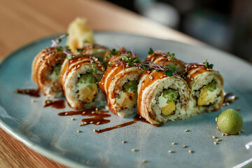Delicious fresh sushi roll set with unagi and sesame decorated and served on a plate
