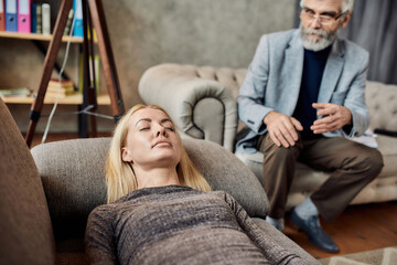 Comforted young caucasian woman lying on couch