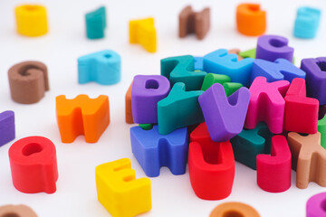 Colorful polymer clay letters in a pile