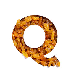 Letter Q of alphabet made of natural raisins and paper cut isolated on white. Typeface from dry...