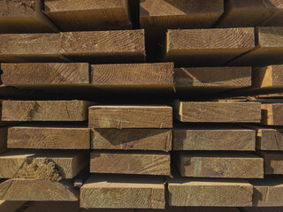 Stack of edged boards. Outdoor warehouse of lumber