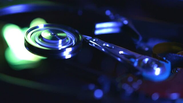 close-up view of working opened hard disk drive (looping)