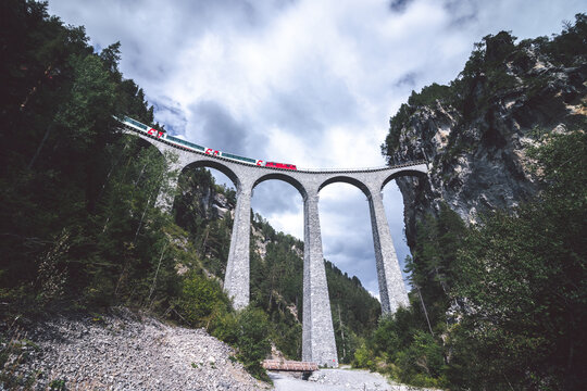 Train passing the Landwasserviadukt in Filisur, Switzerland. September 2020