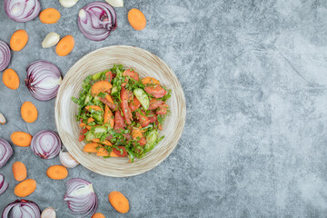 A wooden plate of delicious vegetable salad