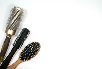 Professional combs on a white background. Three combs on a light background. Space for the text.