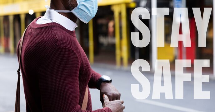 mixed race man wearing Coronavirus covid19 mask with words Stay Safe