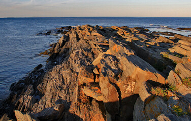Rocks stretch to ocean