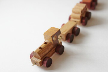 wooden toy train on a white background
