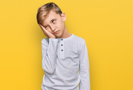 Little caucasian boy kid wearing casual clothes thinking looking tired and bored with depression problems with crossed arms.