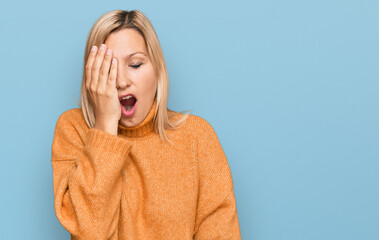 Middle age caucasian woman wearing casual winter sweater yawning tired covering half face, eye and mouth with hand. face hurts in pain.