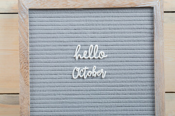 Hello october poster on brown background