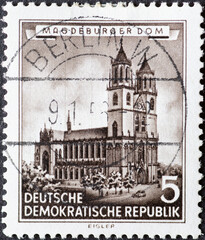 GERMANY, DDR - CIRCA 1955  : a postage stamp from Germany, GDR showing a drawing of the Magdeburg Cathedral. Restored historical buildings