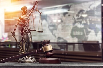 Antique beautiful blind Femida statue and wooden gavel