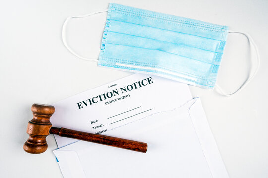 Eviction Notice, Notice To Quit Document With Facial Mask And Gavel During Covid-19. Flat Lay.