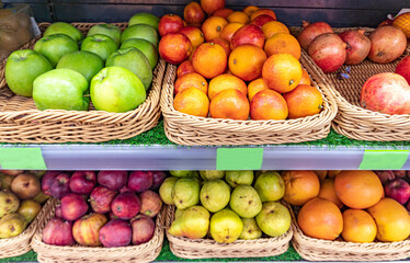 Shelf with fruits on a farm market, fresh fruits on supermarket display