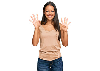 Beautiful hispanic woman wearing casual clothes showing and pointing up with fingers number nine...