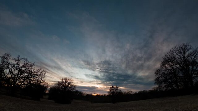 Sunset time lapse in wide angle winter landscape