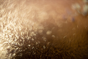 abstract gold glitter background bokeh. Elegant gold background with glitter sparkle bokeh. defocus