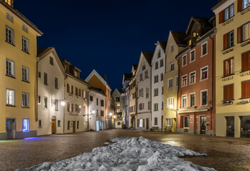 The old town square of the medieval town of Chur, which is also the oldest city in Switzerland, in the blue hour of winter time