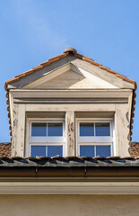 The attic window of a medieval building in Chur, Switzerland