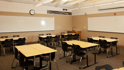 Empty desks in empty class room. Schools are closed due to COVID-19 quarantine. Let’s get the kids back to school