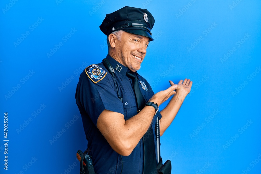 Sticker handsome middle age mature man wearing police uniform inviting to enter smiling natural with open ha