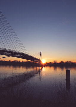 Sunset Under The Mimram Footbridge Over The Rhine River At French German Bodrer In Strasbourg