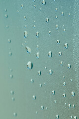 A lot of rain droplets on glass window, close up