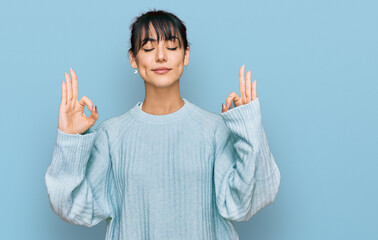 Young hispanic woman wearing casual clothes relaxed and smiling with eyes closed doing meditation...
