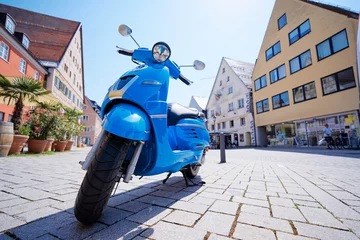 Foto op Plexiglas Motorbike outdoor. Blue retro style scooter on the town street. © luengo_ua