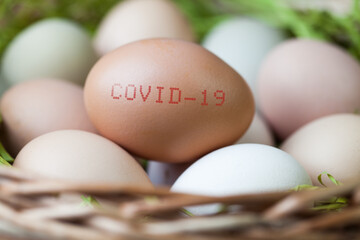 Basket full of eggs, with COVID-19 stamped onto one
