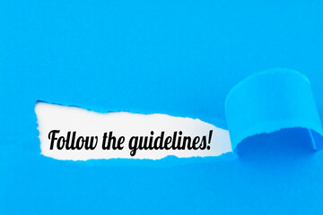 Follow The Guidelines word written under blue torn paper