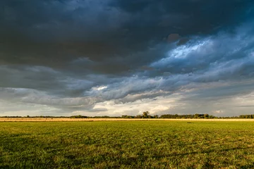 Fotobehang Stormy sky in a rural environment © Diego