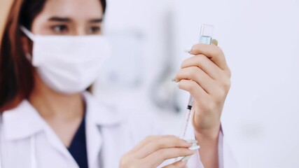 COVID-19 vaccine in researcher hands, female doctor holds syringe and bottle with vaccine for coronavirus cure. Concept of corona virus treatment, injection, shot and clinical trial during pandemic. - Powered by Adobe