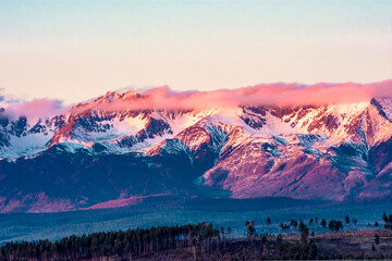 sunrise over the sayans mountains /  pink clouds
