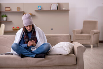 Young man suffering at home